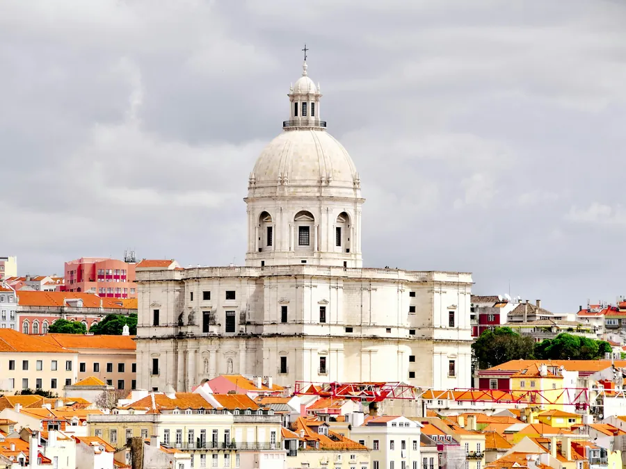Baroque dome of the National Pantheon rising above Alfama's rooftops